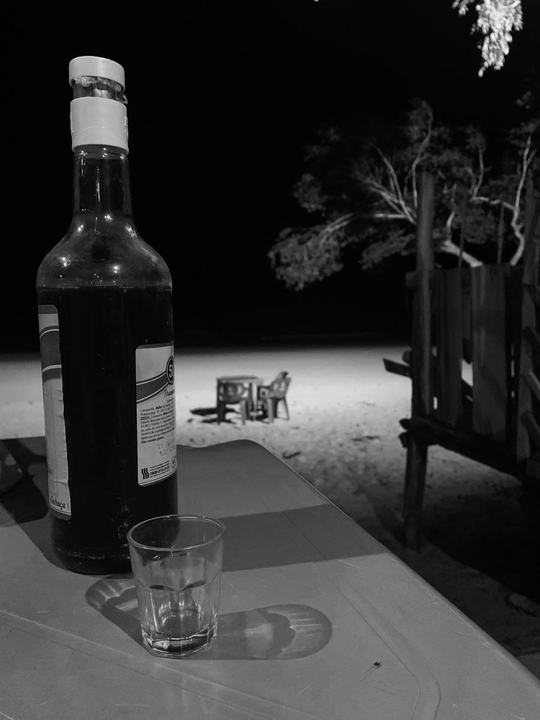 Enjoying a home made Cachaça at the Restaurant Sonho Mio at night. Ilha do Cotijuba Pará | 2020